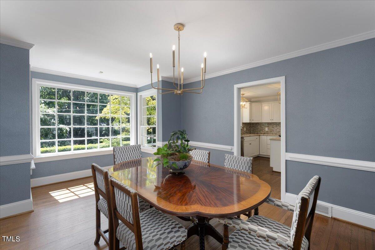 2803 Exeter Circle Raleigh, NC 27608 - Photo 6 of 38 a view of a dining room with furniture window and outside view
