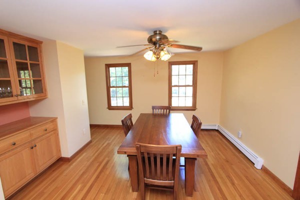 103 Snake Pond Road Sandwich, MA 02644 - Photo 3 of 4 a view of a dining room with furniture window and wooden floor