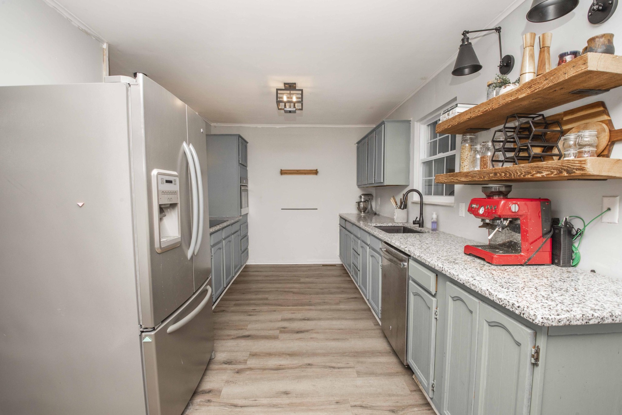 395 Mountain View Road Lenoir City, TN 37771 - Photo 15 of 34 a kitchen with stainless steel appliances granite countertop a refrigerator and a sink