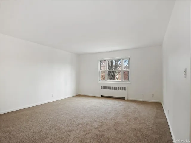 an empty room with a bench