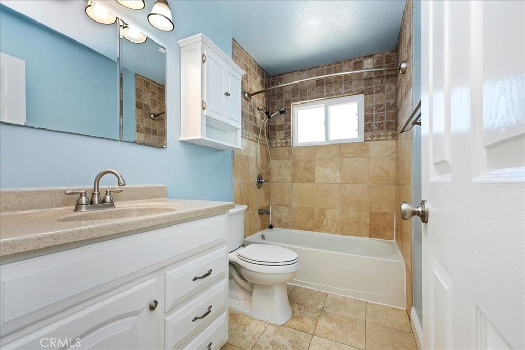3112 Glenn Road Oceanside, CA 92056 - Photo 21 of 30 a bathroom with a sink toilet tub and shower
