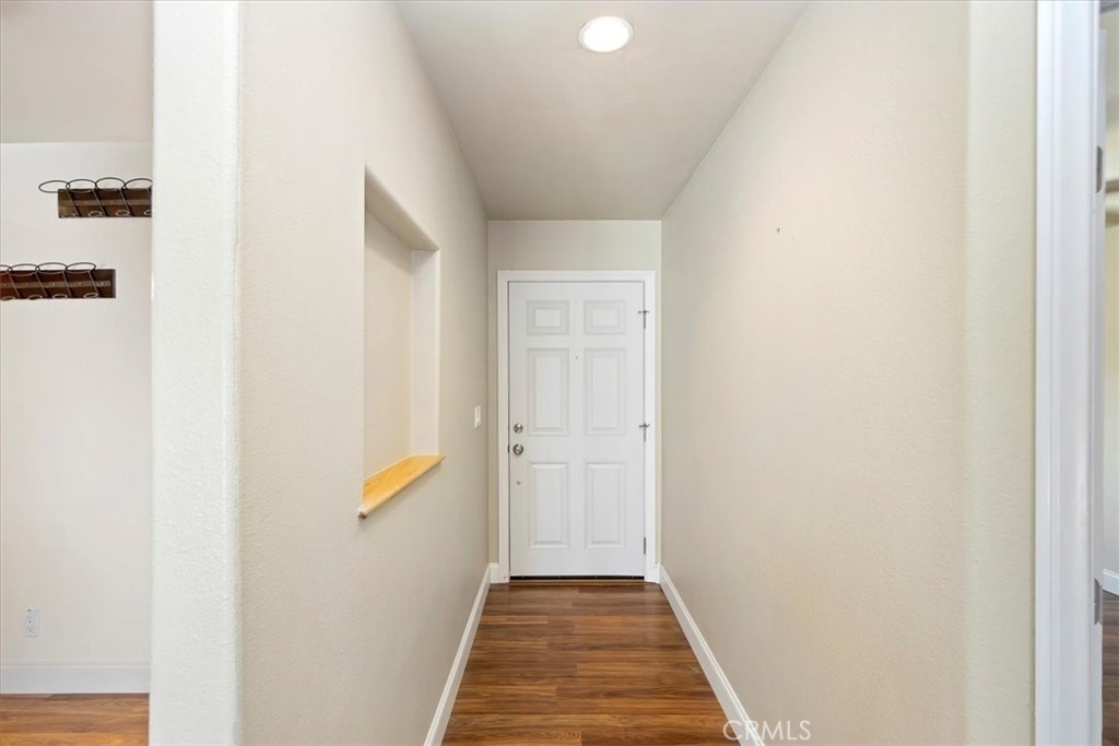 3112 Glenn Road Oceanside, CA 92056 - Photo 7 of 30 a view of a hallway with wooden floor