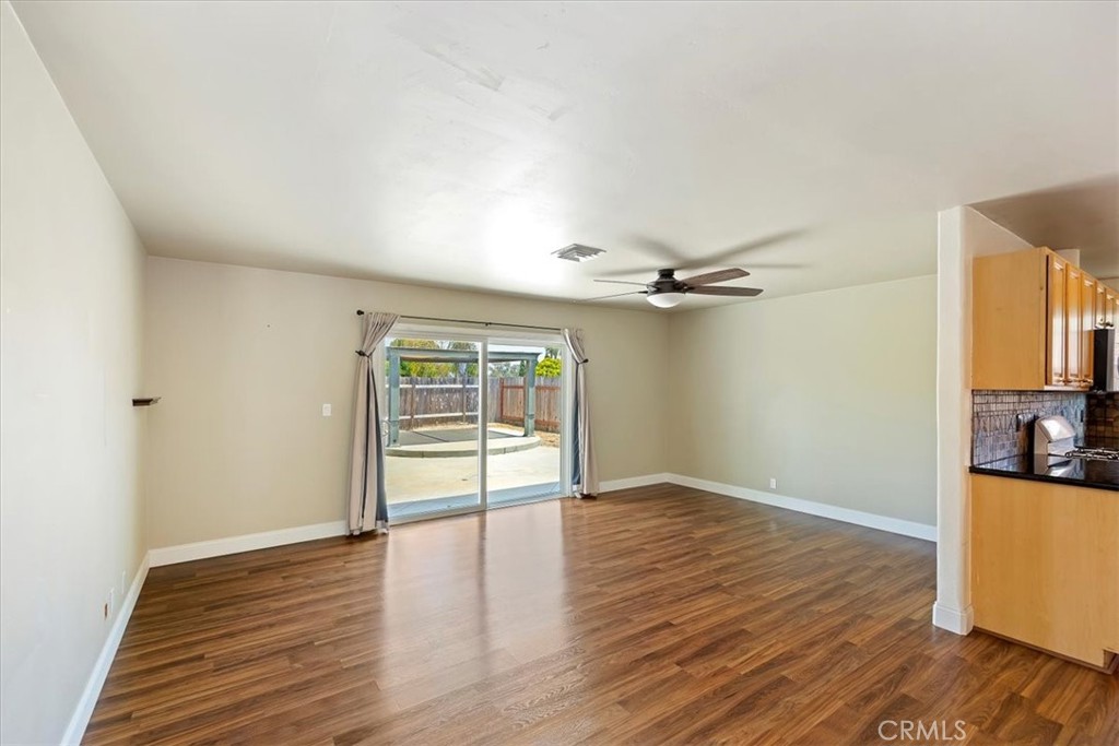 3112 Glenn Road Oceanside, CA 92056 - Photo 8 of 30 an empty room with wooden floor and windows