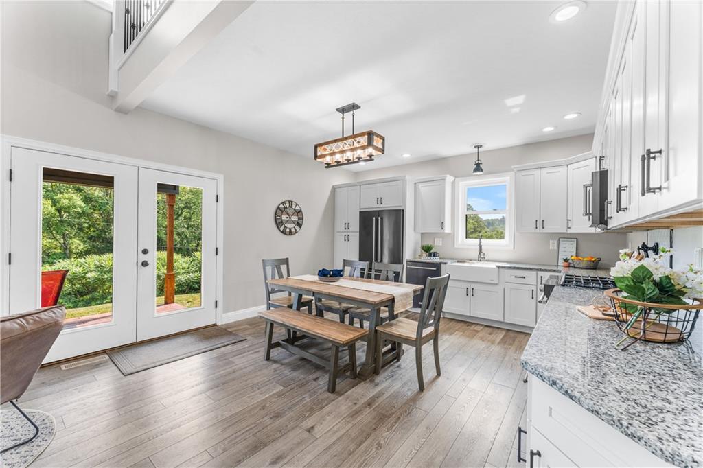 2460 Chapel Road Beaver, PA 15009 - Photo 11 of 42 a view of a dining room with furniture window and wooden floor