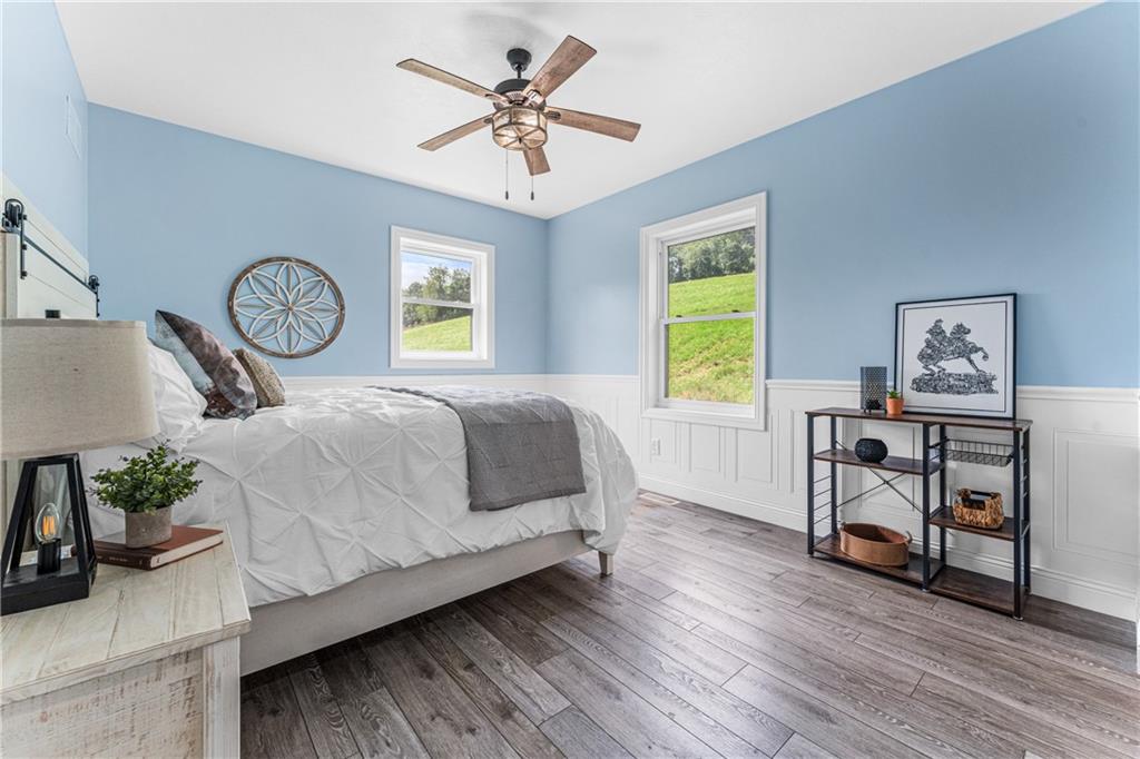 2460 Chapel Road Beaver, PA 15009 - Photo 16 of 42 a bedroom with a bed and a chandelier