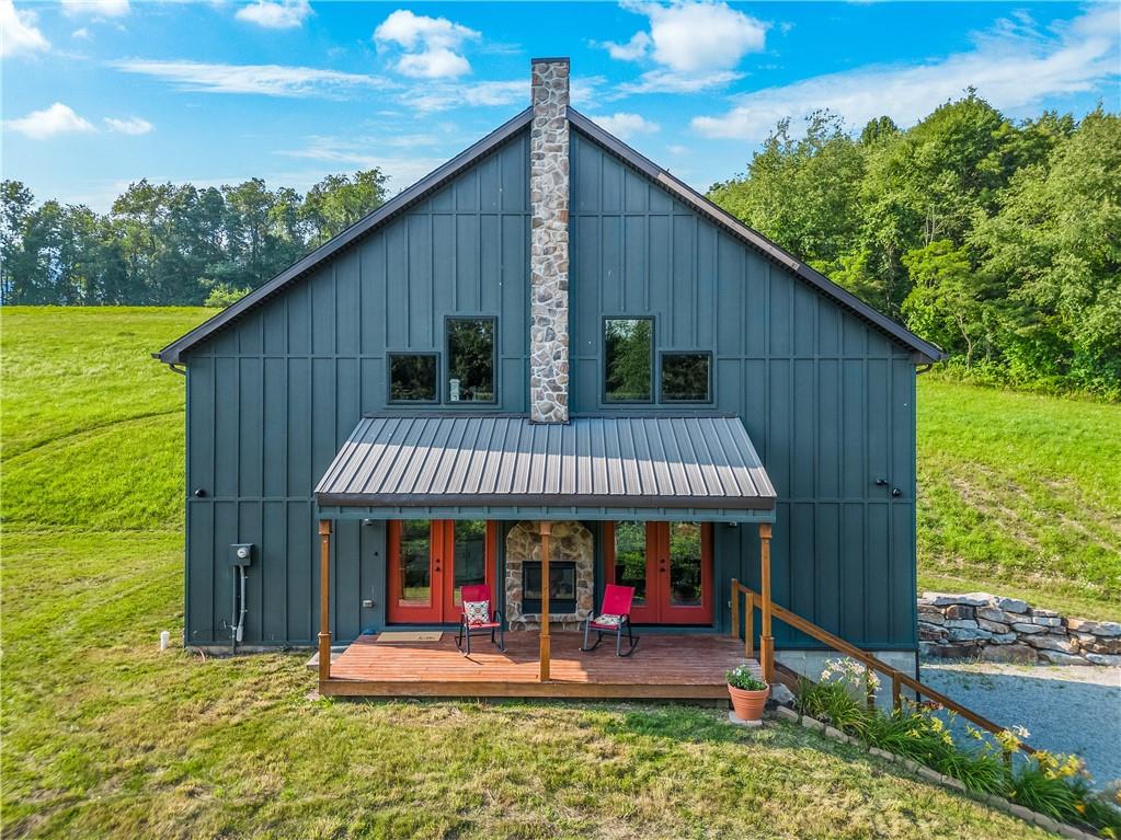 2460 Chapel Road Beaver, PA 15009 - Photo 2 of 42 a front view of a house with porch
