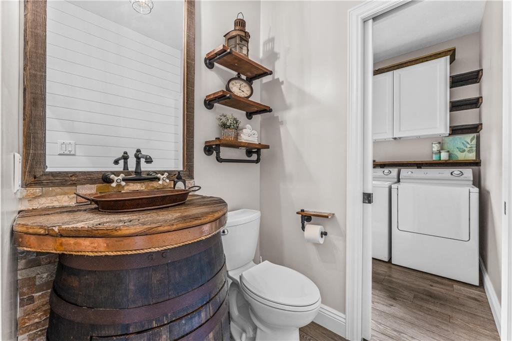 2460 Chapel Road Beaver, PA 15009 - Photo 23 of 42 a view of washer and dryer with wooden floor