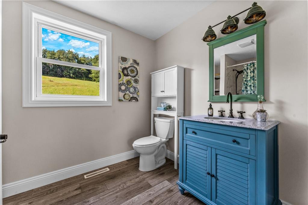 2460 Chapel Road Beaver, PA 15009 - Photo 31 of 42 a bathroom with a toilet a sink and mirror