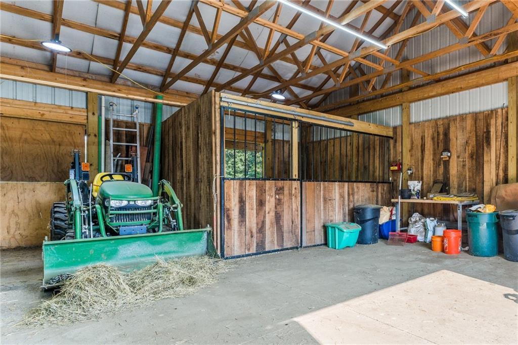 2460 Chapel Road Beaver, PA 15009 - Photo 35 of 42 a backyard with potted plants and a wooden bench