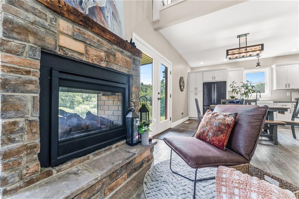 2460 Chapel Road Beaver, PA 15009 - Photo 8 of 42 a living room with furniture a flat screen tv and a fireplace