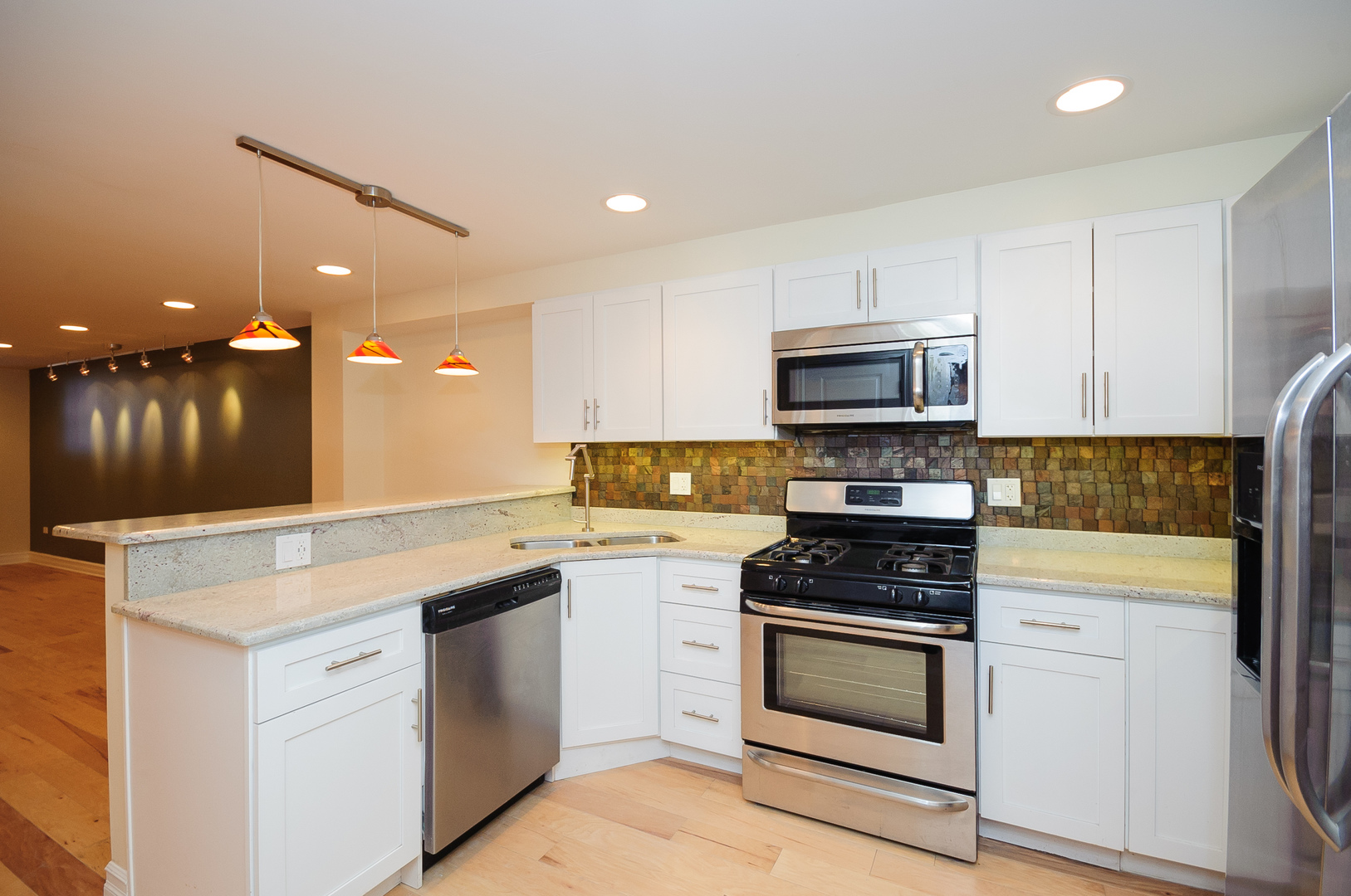 2155 West Potomac Avenue, Unit GDN Chicago, IL 60622 - Photo 2 of 16 a kitchen with granite countertop white cabinets and white appliances