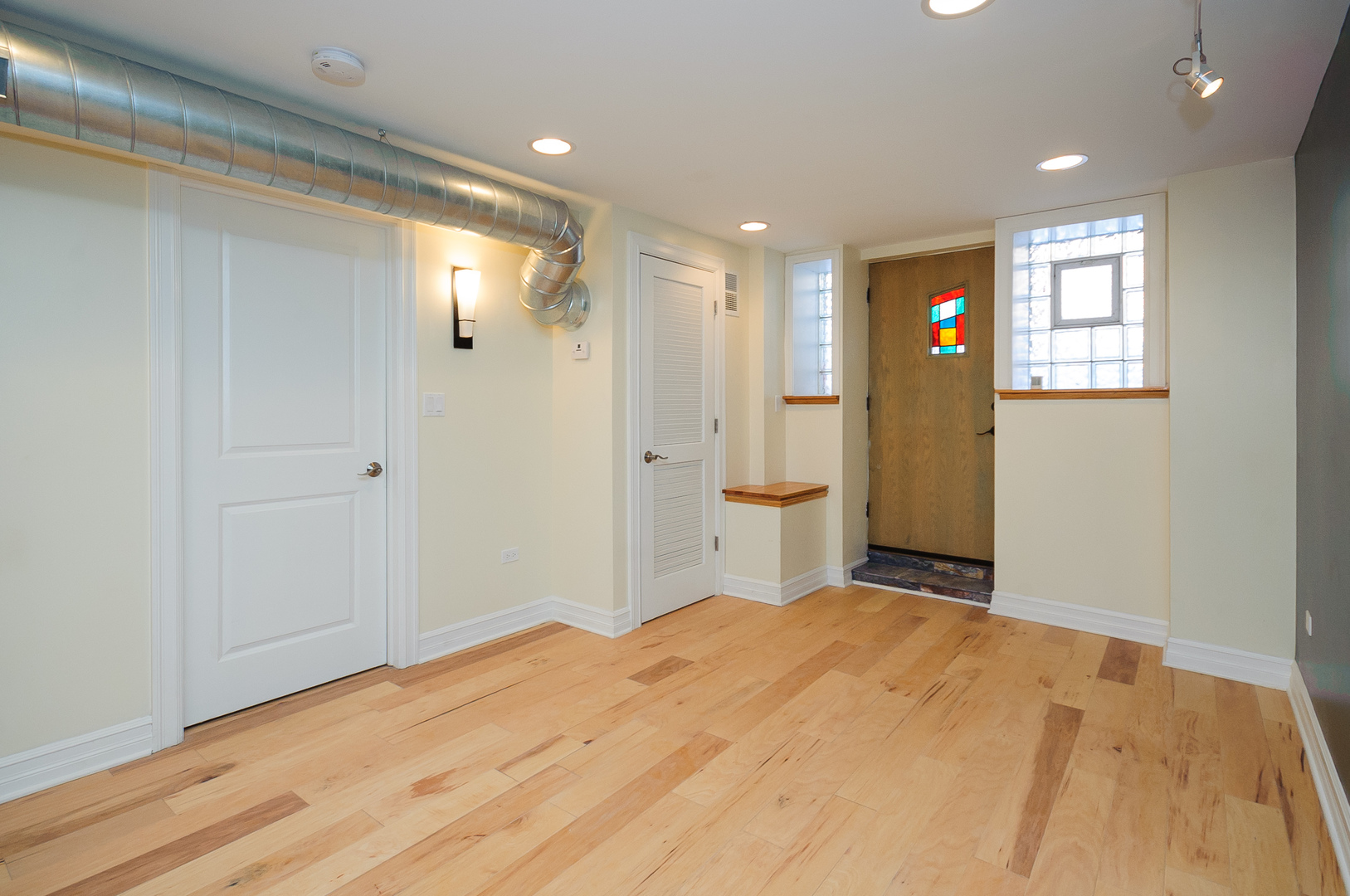 2155 West Potomac Avenue, Unit GDN Chicago, IL 60622 - Photo 6 of 16 a view of a big room with wooden floor and windows