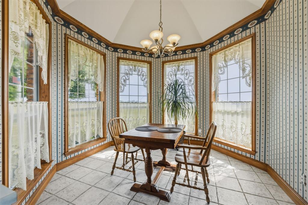 130 Blazek Road Alma, TX 75119 - Photo 12 of 34 a view of a dining room with furniture and chandelier