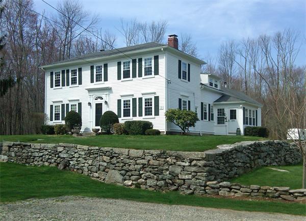 254 Boston Road Sutton, MA 01590 - Photo 1 of 1 a front view of a house with a yard