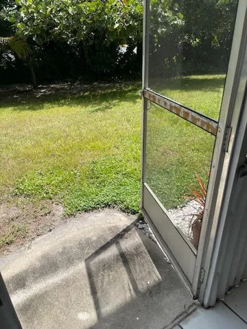 a view of a backyard of the house