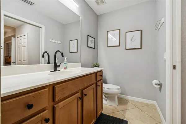 a en suite bathroom with a sink and a mirror