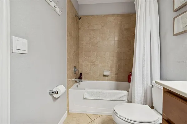 a bathroom with a sink vanity and a toilet