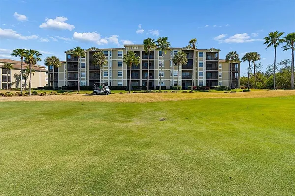 an aerial view of residential houses with outdoor space and swimming pool
