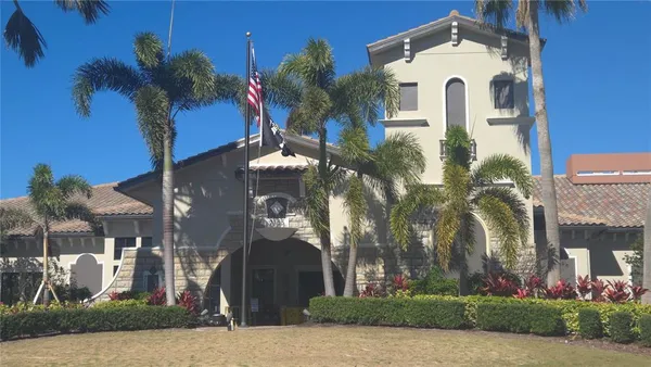 a view of a dining room with furniture wooden floor and chandelier