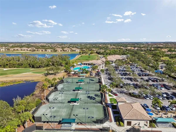 an aerial view of a house with a lake view