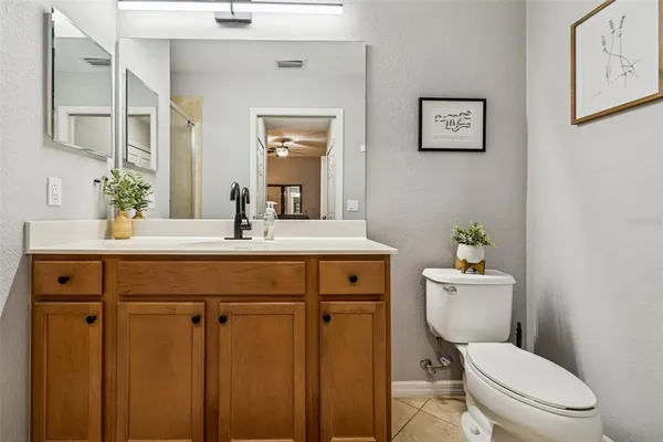 a bathroom with a shower sink and mirror