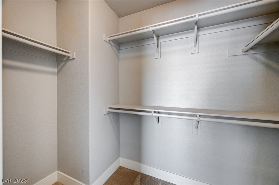 7259 Cestrum Road Las Vegas, NV 89113 - Photo 18 of 35 Ample closet space with shelving and hanging rods to organize your wardrobe.