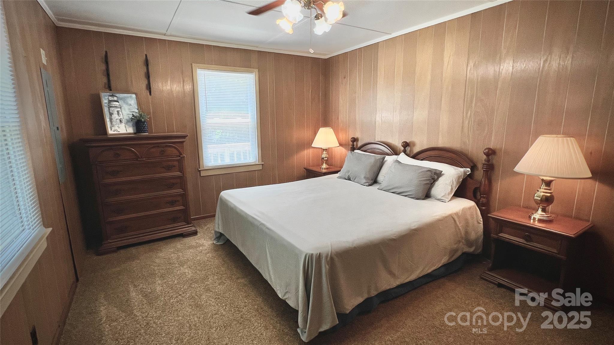 2298 Singleton Creek Road Liberty Hill, SC 29074 - Photo 15 of 21 a bedroom with a bed and a lamp on dresser