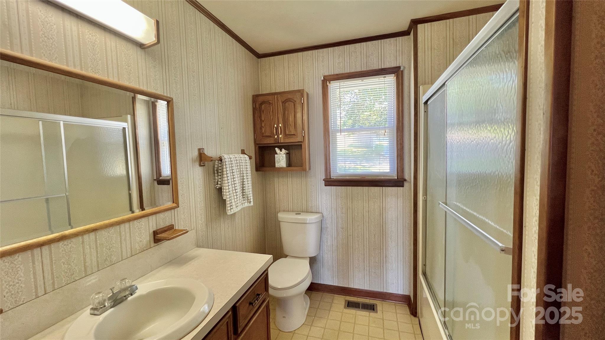 2298 Singleton Creek Road Liberty Hill, SC 29074 - Photo 17 of 21 a bathroom with a sink toilet and shower