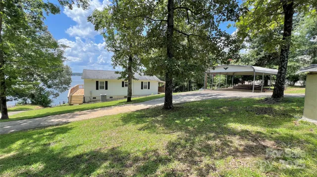 a view of a hallway with workspace and a window