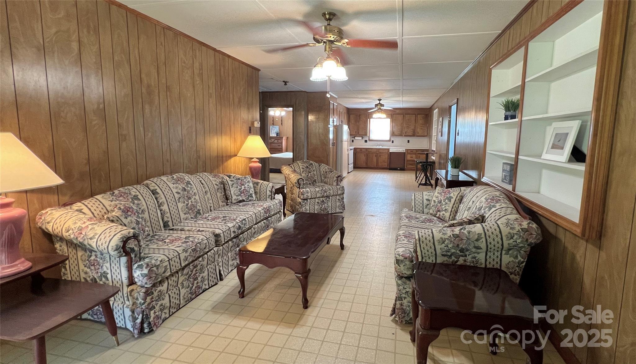 2298 Singleton Creek Road Liberty Hill, SC 29074 - Photo 9 of 21 a living room with furniture and a chandelier