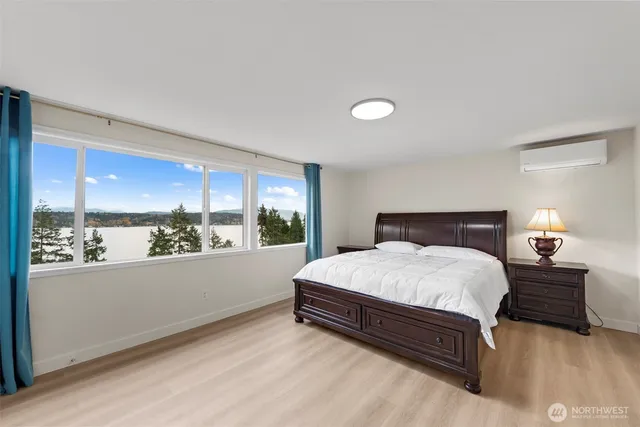 a bedroom with a bed and window