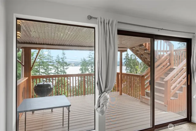 a view of a balcony with wooden floor