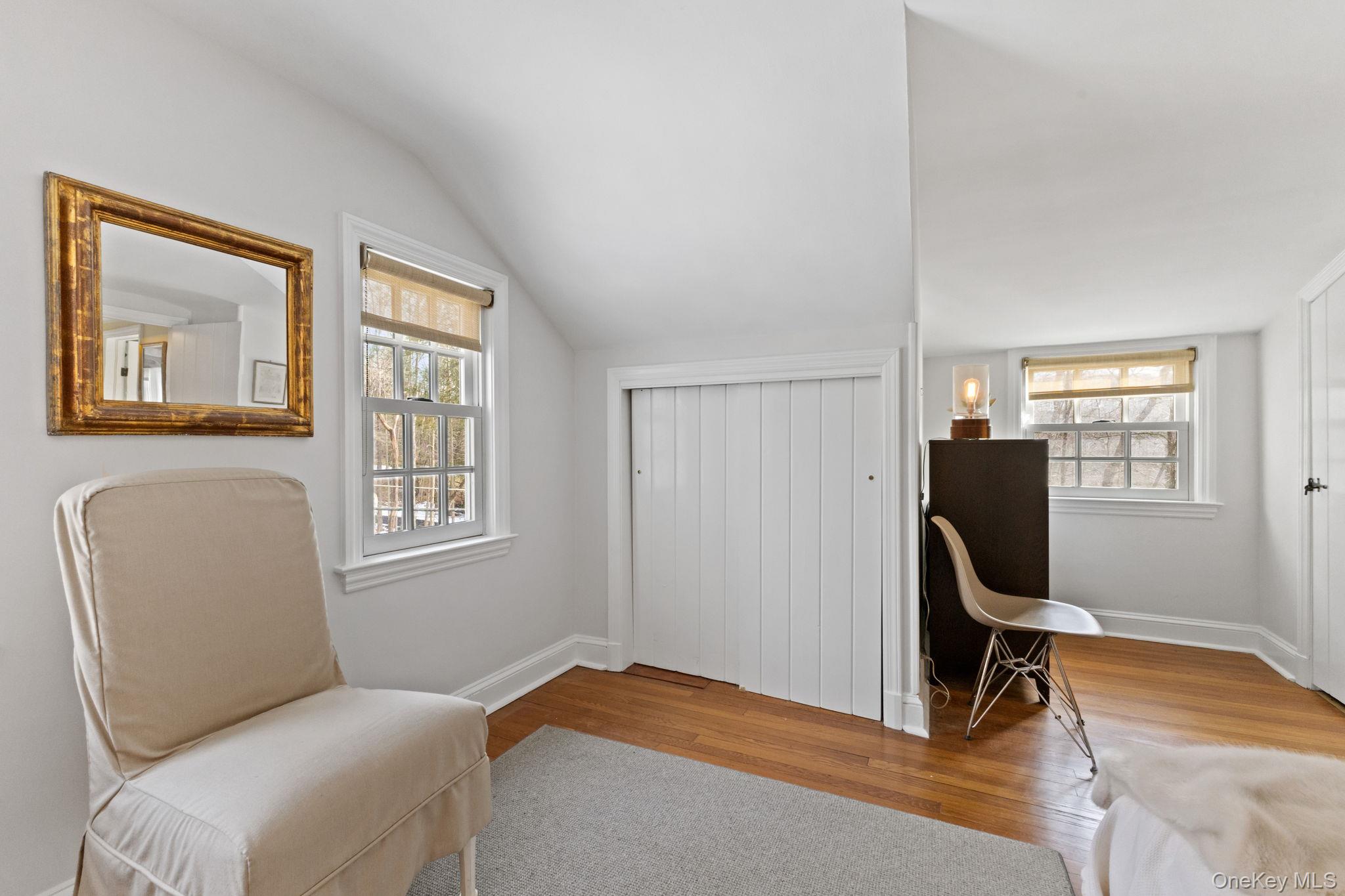 8 South Bedford Road Pound Ridge, NY 10576 - Photo 28 of 32 a bedroom with a bed chair and window