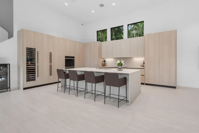 a kitchen with a cabinets and chairs