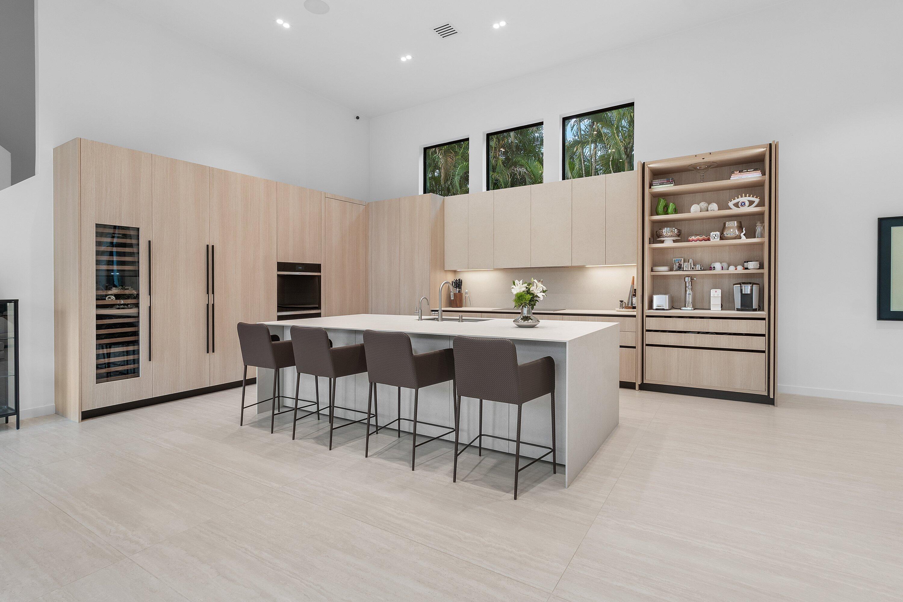 6026 Northwest 31st Way Boca Raton, FL 33496 - Photo 12 of 61 a kitchen with a cabinets and chairs