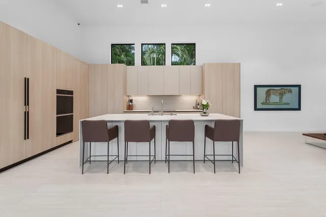 a kitchen with a refrigerator and cabinets