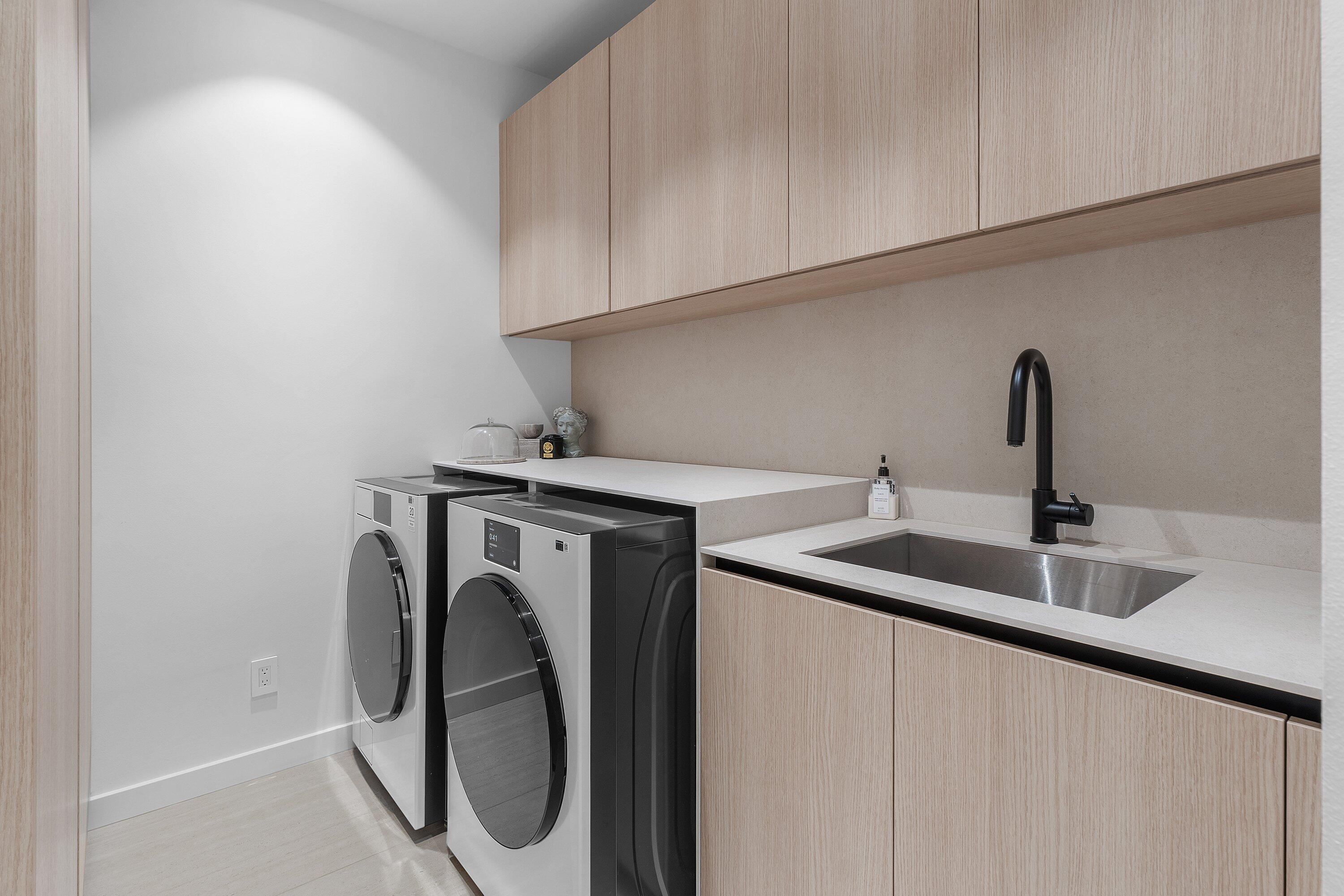 6026 Northwest 31st Way Boca Raton, FL 33496 - Photo 19 of 61 a utility room with sink dryer and washer