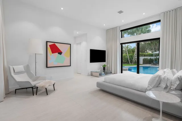 a spacious bathroom with a double vanity sink a mirror and shower