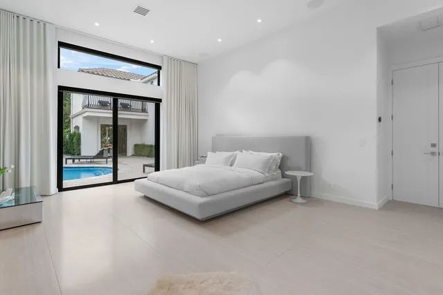 a spacious bathroom with double vanity sink a mirror and a bathtub