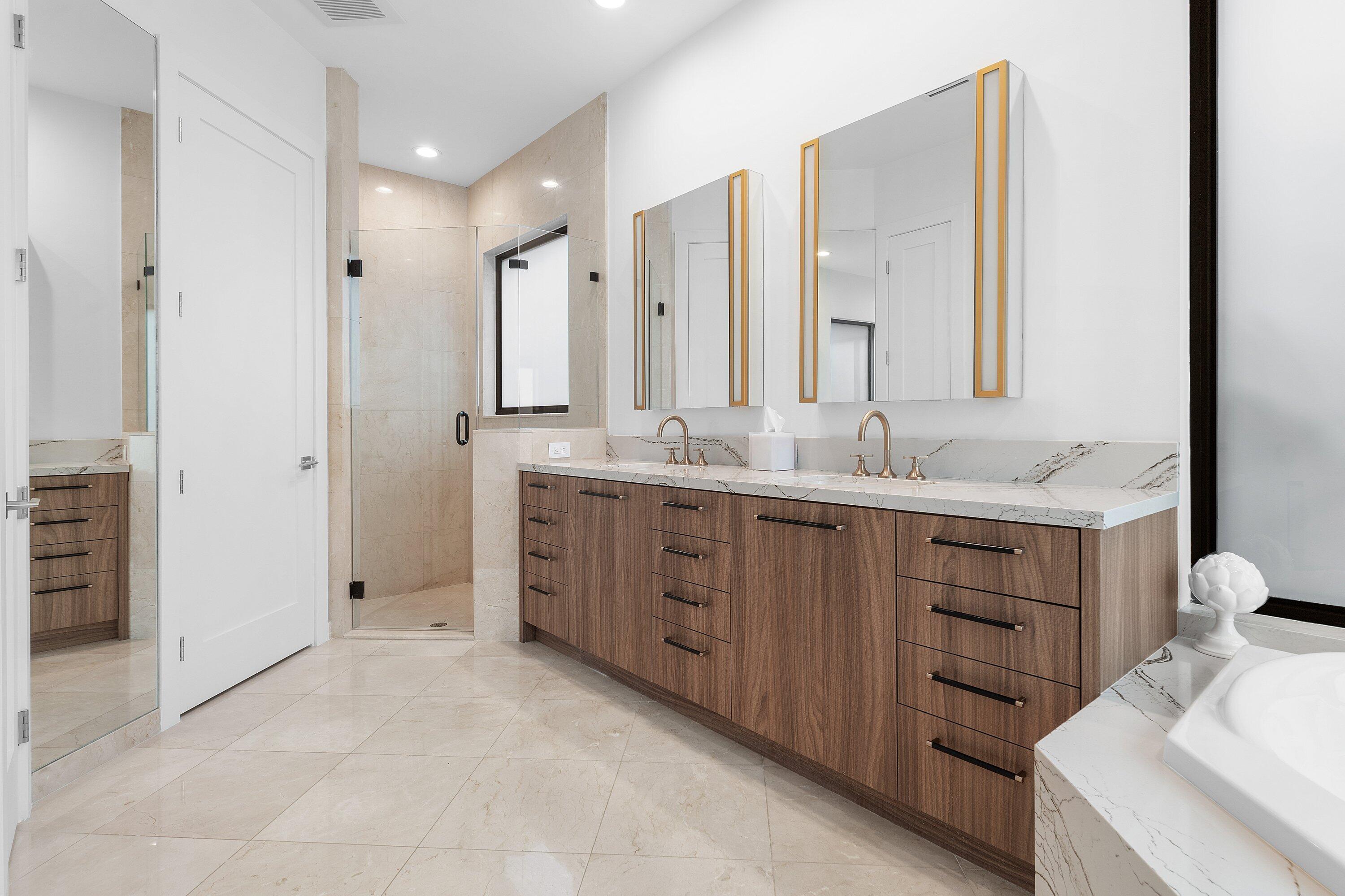 6026 Northwest 31st Way Boca Raton, FL 33496 - Photo 26 of 61 a spacious bathroom with a double vanity sink a mirror and shower