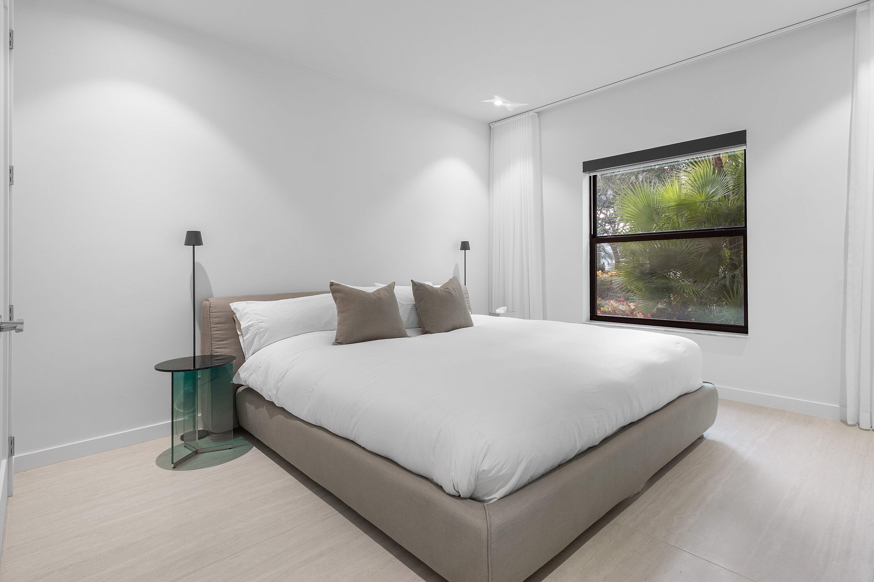 6026 Northwest 31st Way Boca Raton, FL 33496 - Photo 28 of 61 a large bed sitting in a bedroom next to a window