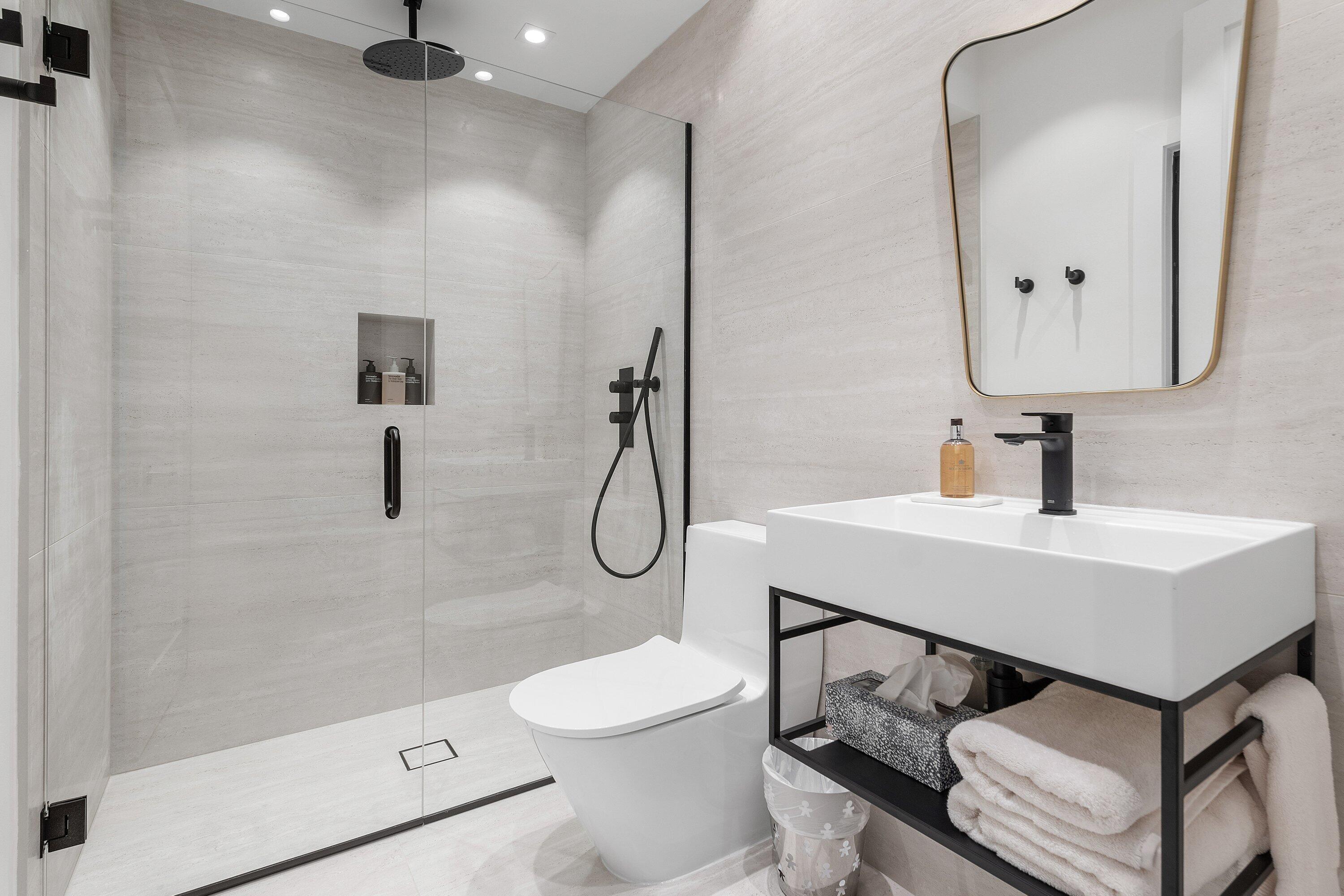 6026 Northwest 31st Way Boca Raton, FL 33496 - Photo 29 of 61 a bathroom with a sink toilet and shower