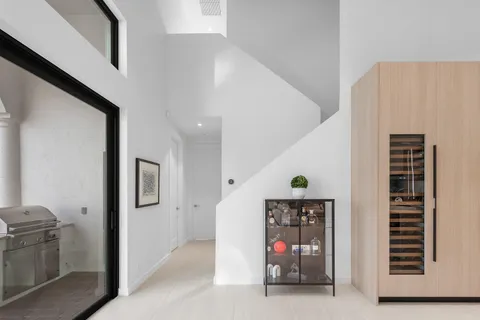 a view of swimming pool with outdoor seating and plants