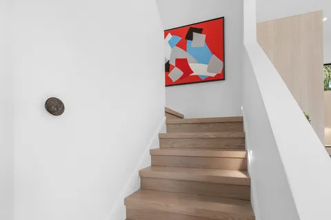a view of a house with swimming pool and sitting area