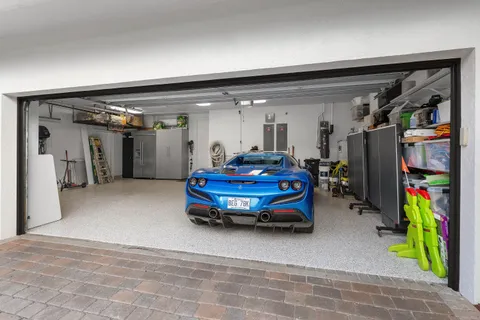 a view of a house with swimming pool and sitting area