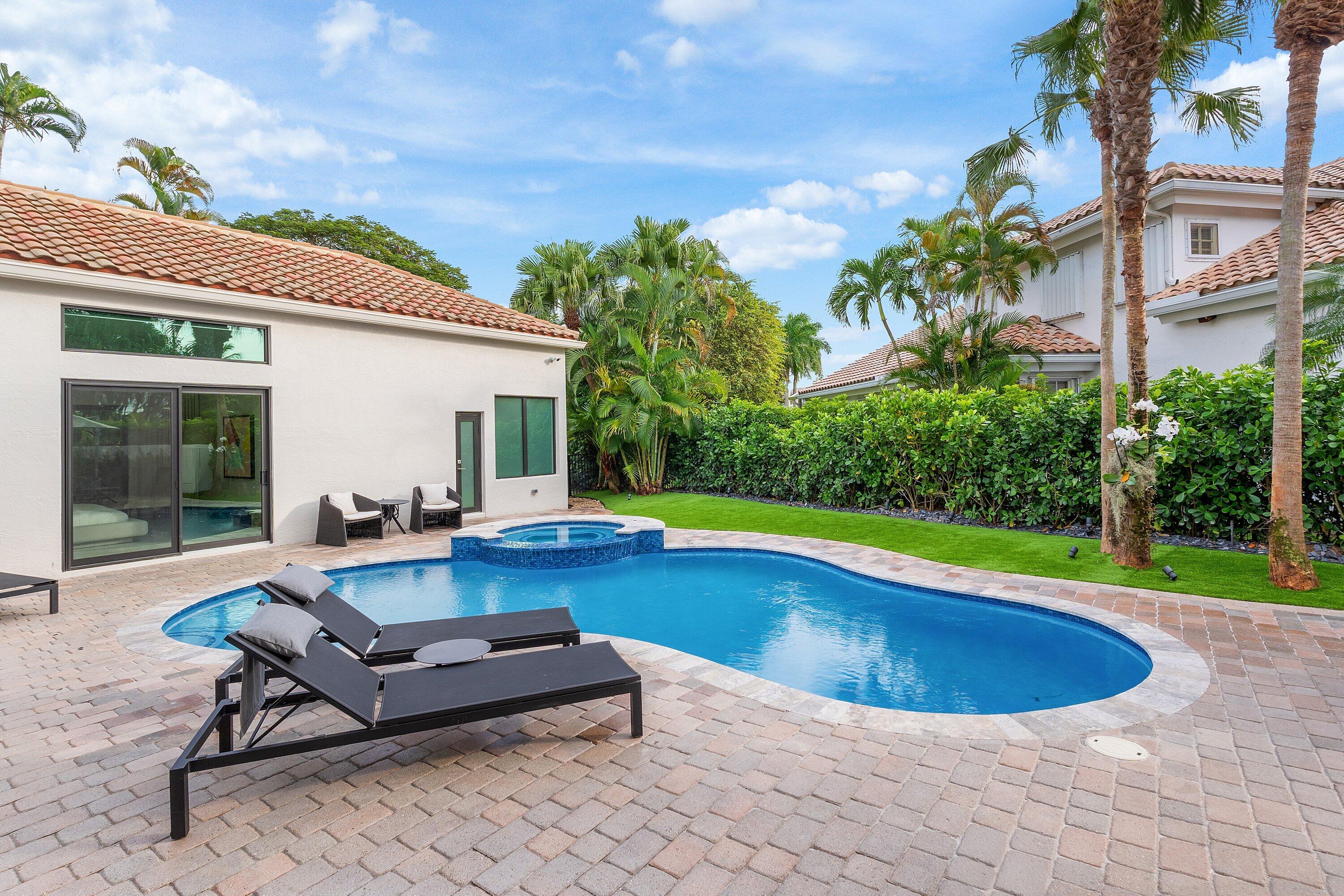 6026 Northwest 31st Way Boca Raton, FL 33496 - Photo 43 of 61 a view of swimming pool with lounge chair