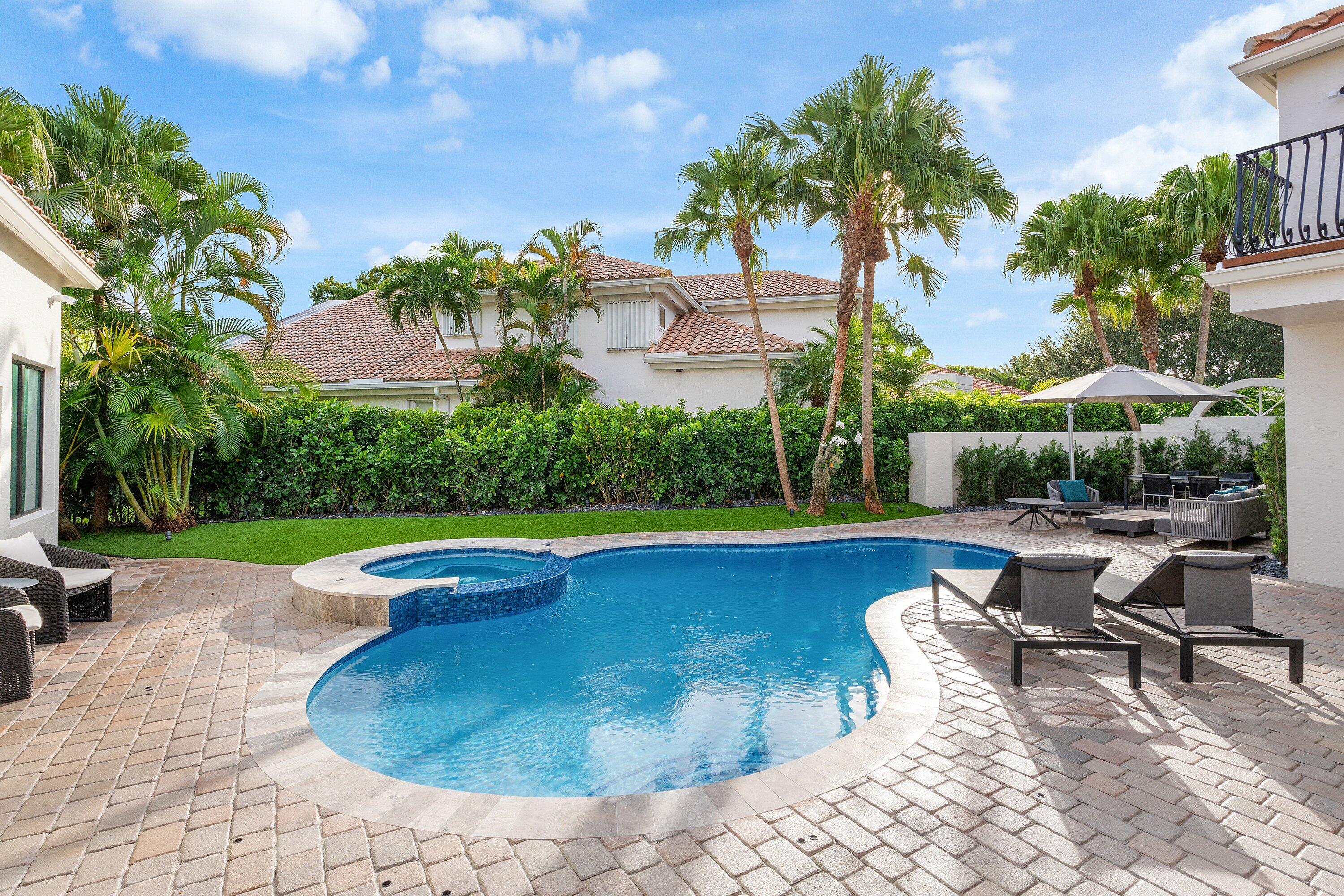 6026 Northwest 31st Way Boca Raton, FL 33496 - Photo 45 of 61 a view of swimming pool with outdoor seating and plants