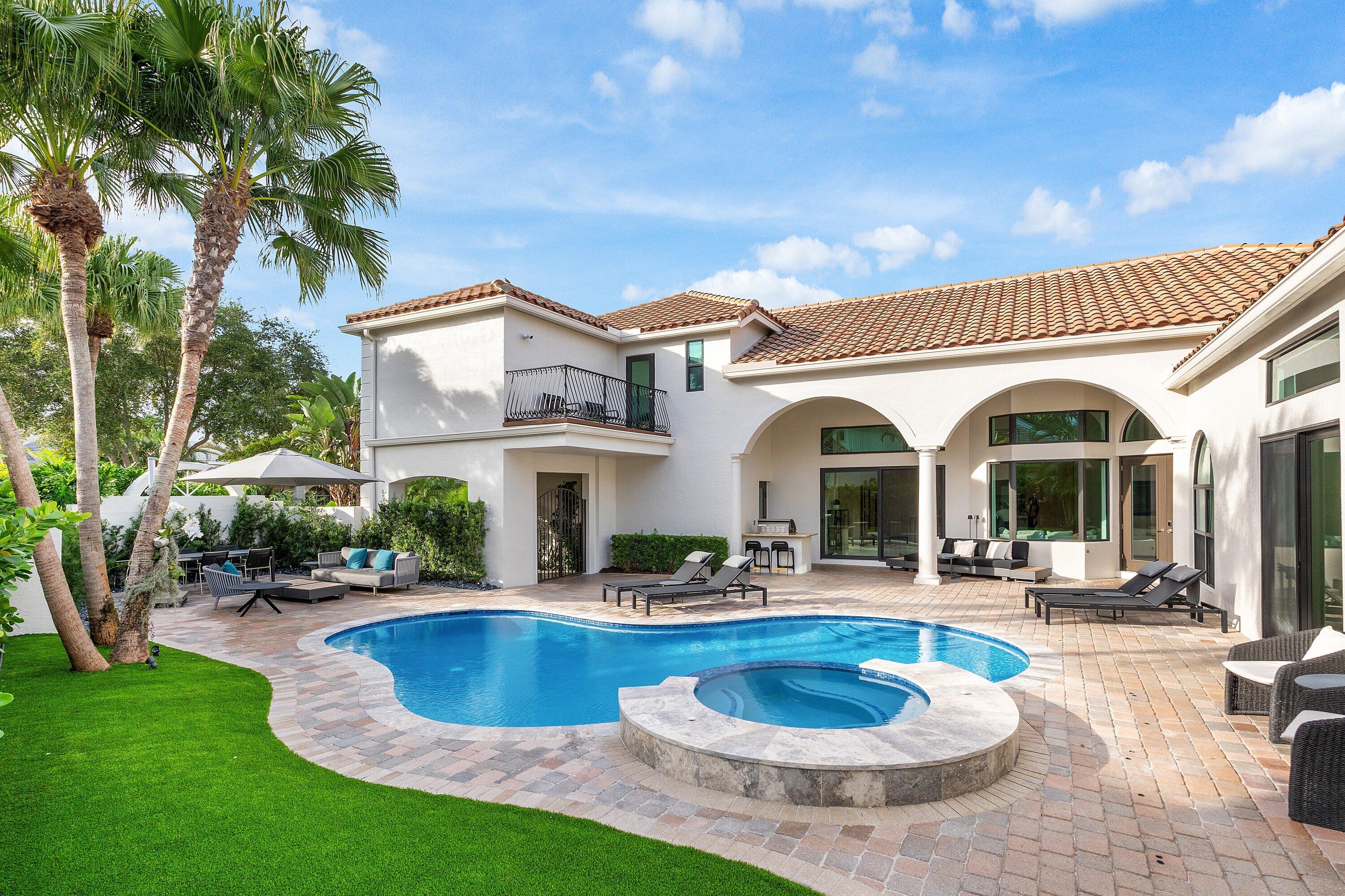 6026 Northwest 31st Way Boca Raton, FL 33496 - Photo 47 of 61 a view of a house with swimming pool and sitting area
