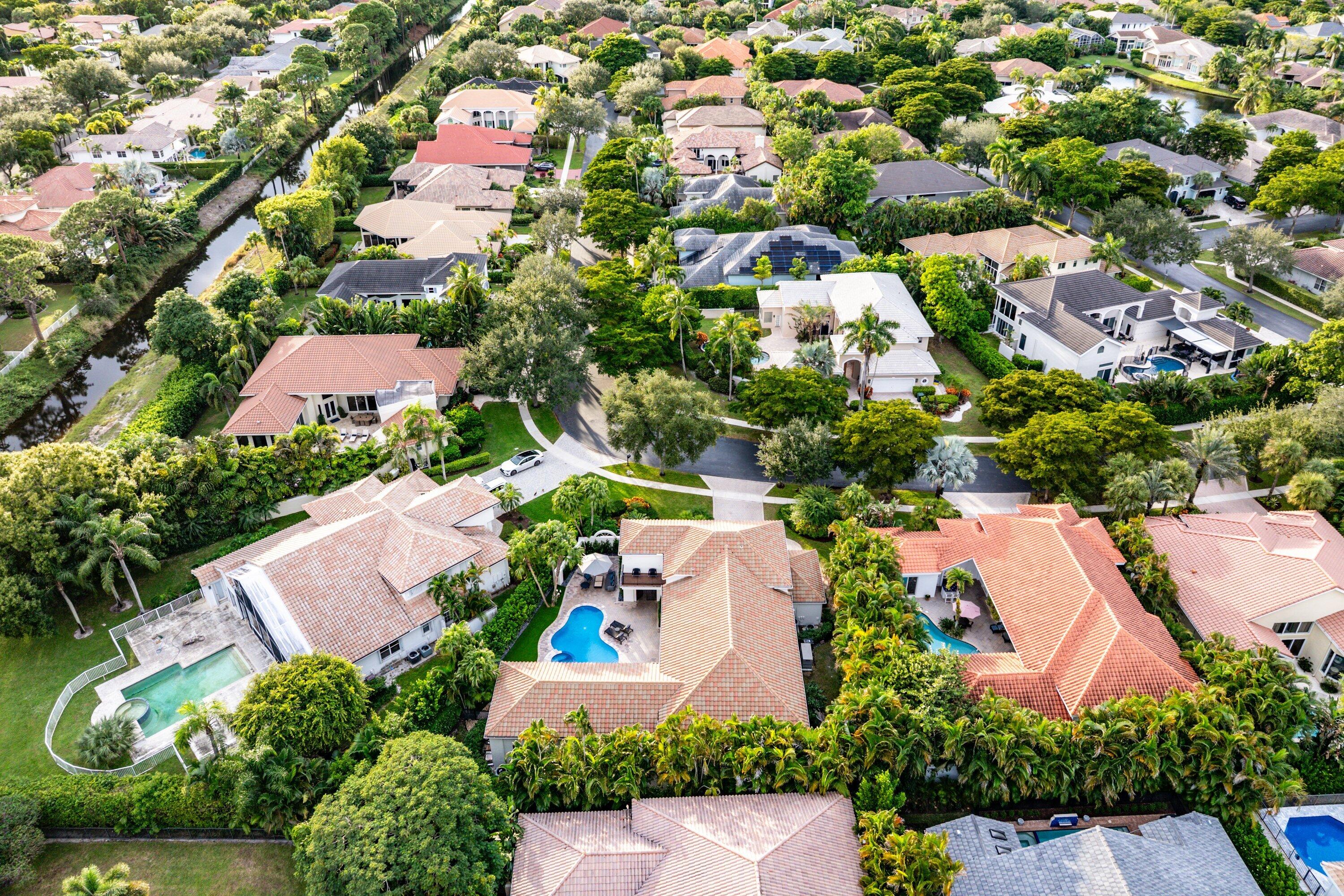 6026 Northwest 31st Way Boca Raton, FL 33496 - Photo 61 of 61 an aerial view of residential house with outdoor space and trees all around