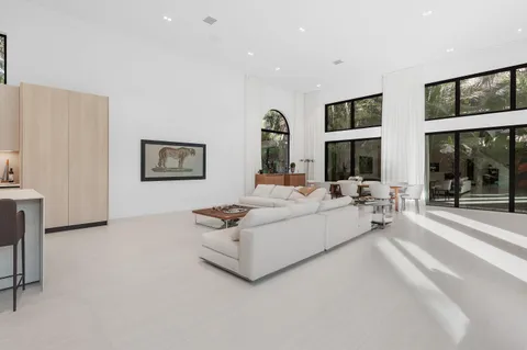 a view of a dining room with furniture and window